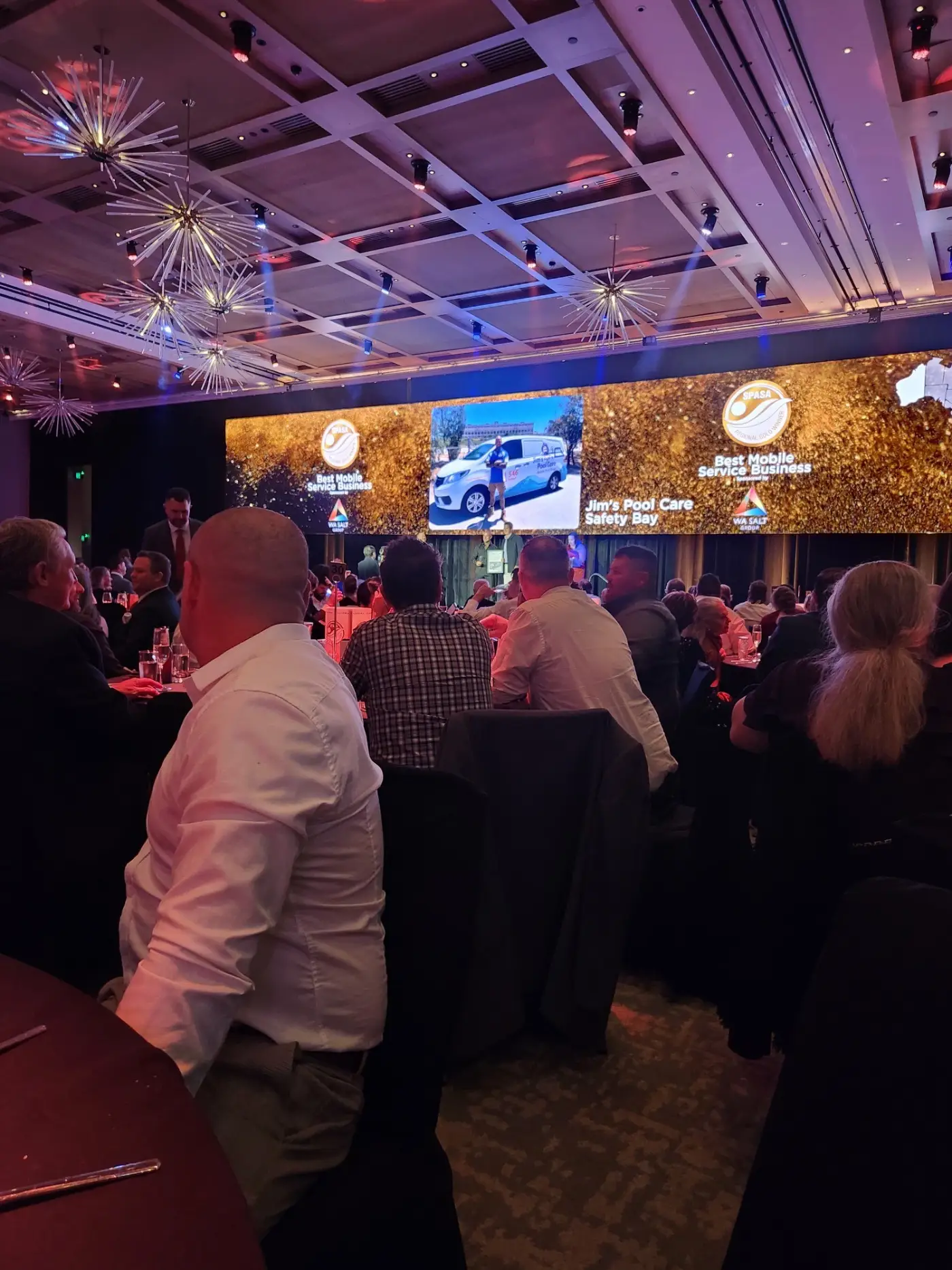 Pool technician performing routine maintenance on a residential pool in Safety Bay with professional equipment.
