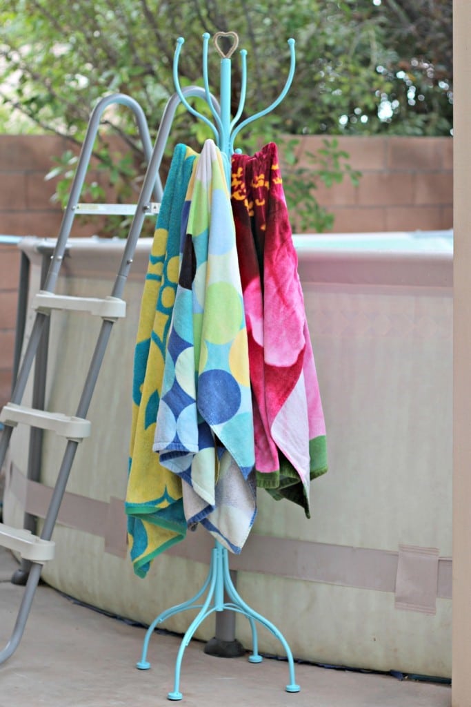 A towel rack displaying several neatly hung towels in various colors