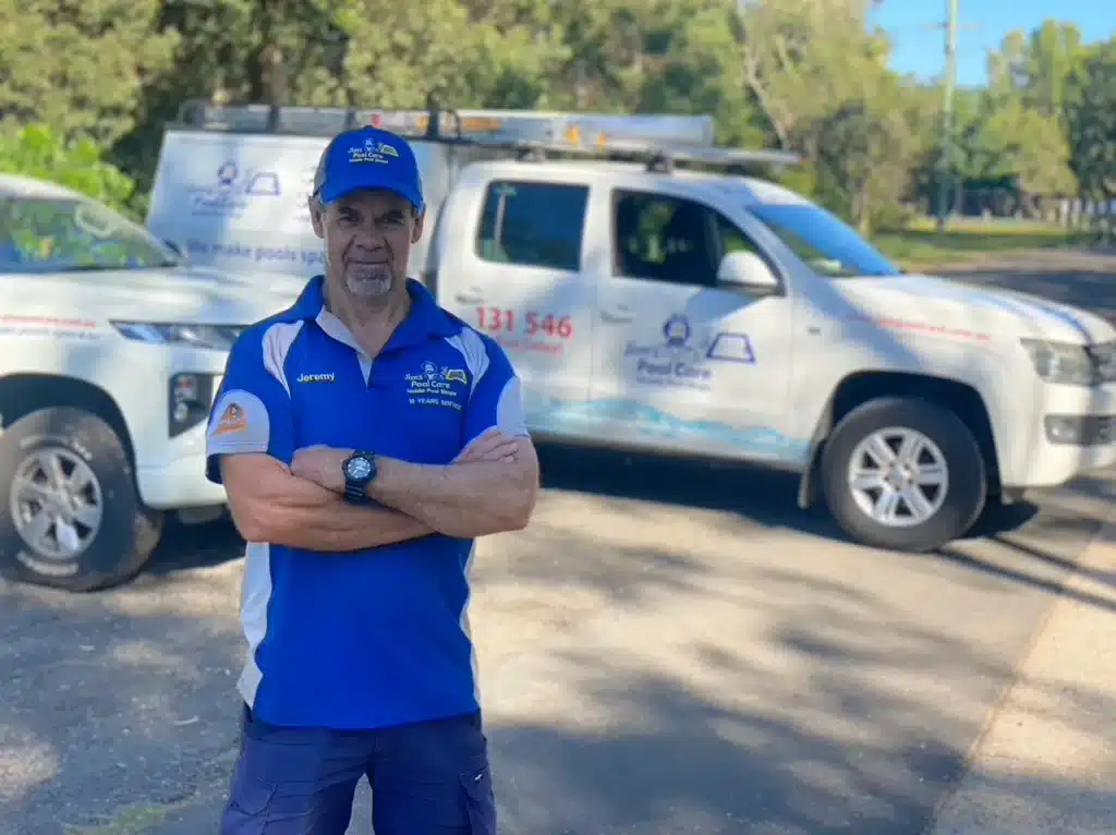 pool-service-worker-beside-vehicles