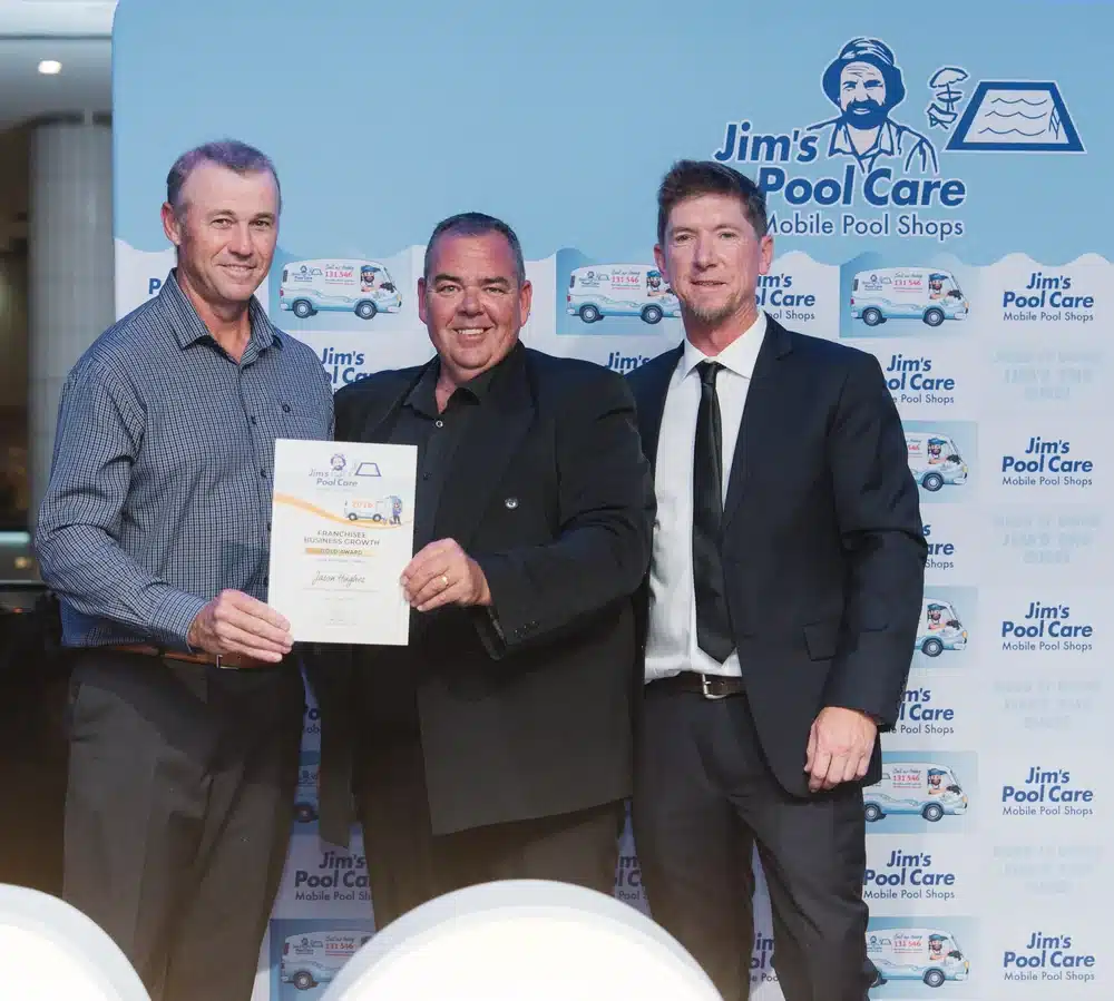Jason Hughes of Jim's Pool Care Idalia accepting the Franchisee Business Growth 2026 Gold Award