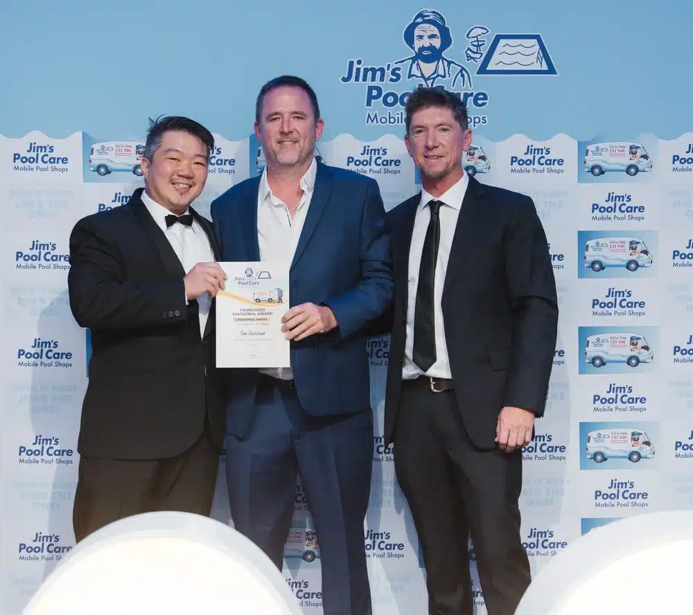 Tim Sheehan of Jim's Pool Care Park Ridge accepting the Franchisee Divisional Award 2026