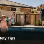 Jim’s Pool Care technician sharing pool safety tips with a parent supervising a young child beside a fenced backyard pool