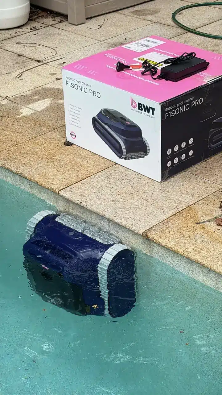 Robotic pool cleaner working in a Wellington Point swimming pool